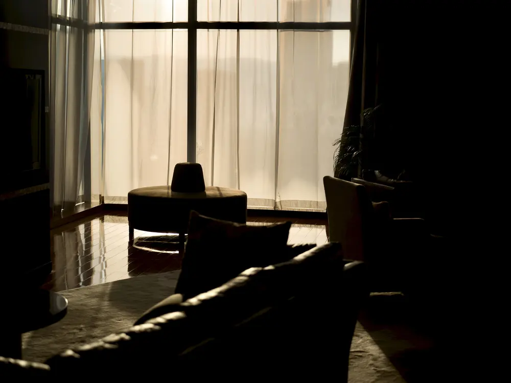 Empty room with bright covered window.